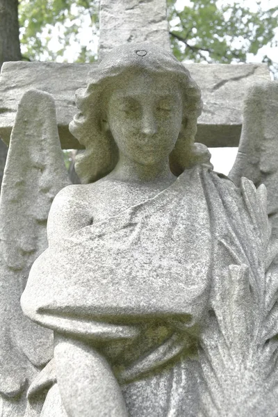 Figure of angel with wings.