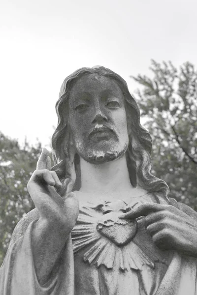 Stature depicting Sacred Heart of Jesus. Stone sculpture of  devotion to Sacred Heart of Jesus Christ.