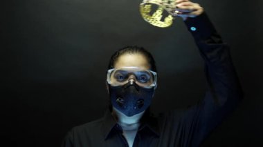 Woman in urban protective air mask with glasses, wearing crown or corona. Coronavirus pathogen outbreak pandemic concept. Virus disease 2019-nCoV or covid-19 protection and prevention. 4k