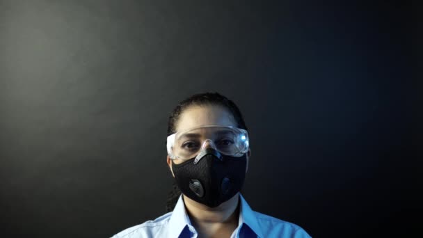 Woman in urban protective air mask with glasses, wearing crown or corona. Coronavirus pathogen outbreak pandemic concept. Virus disease 2019-nCoV or covid-19 protection and prevention. 4k — Stok video