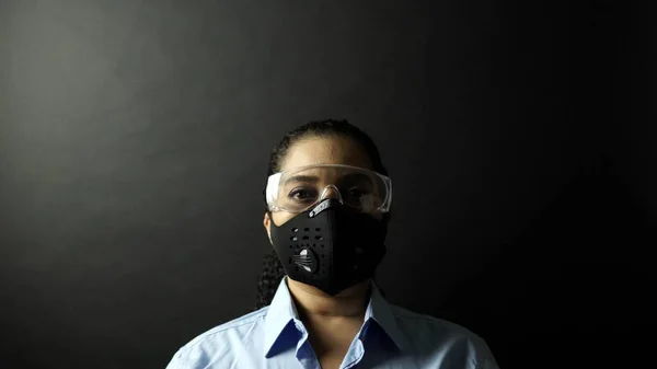 Woman in urban protective or medical mask with glasses, looking — Stock Photo, Image