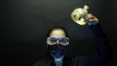 Coronavirus pathogen outbreak pandemic concept. Woman in urban protective air mask and glasses wearing crown or corona. Virus disease 2019-nCoV or covid-19 coronavirus protection and prevention. 4k