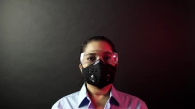 Woman in surgical or medical mask put on the crown on the head, depicting Coronavirus or covid 19, virus outbreak concept. Corona virus disease 2019-nCoV protection and prevention. 4k.