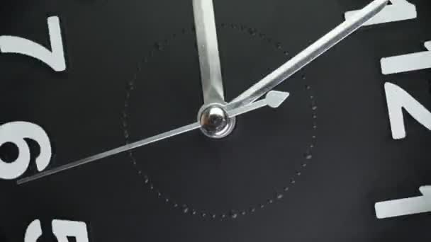 Zoom out macro shot of clock face with rapid rotation and almost static seconds arrow. Fast flow of time concept. Real watch shot with macro lens close-up view. 4k. — Stock Video