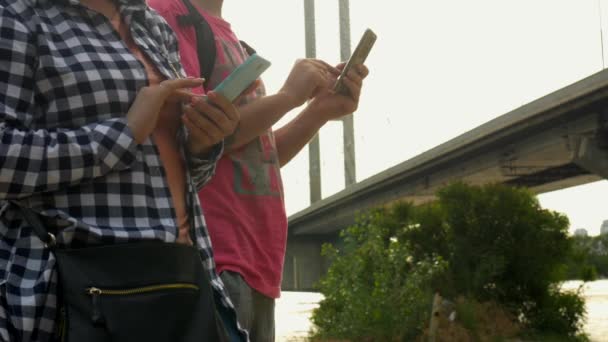 Women and Man on Street Typing Text With Mobile Phone — Stock Video