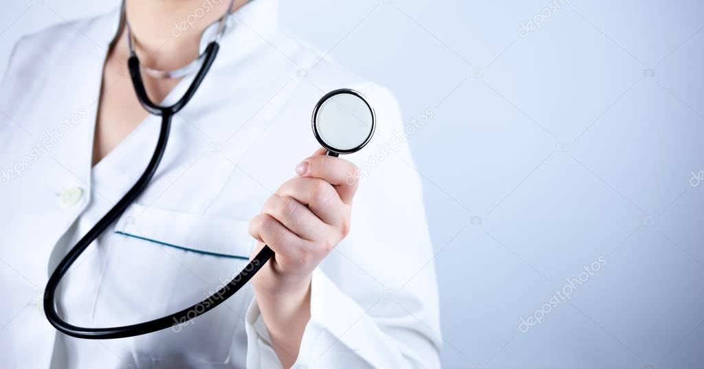 Doctor showing black stethoscope in hand over