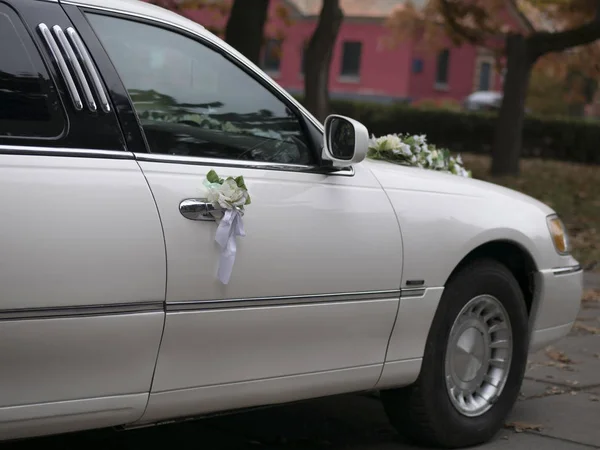 Wedding car decoration for the bride and groom on the car door