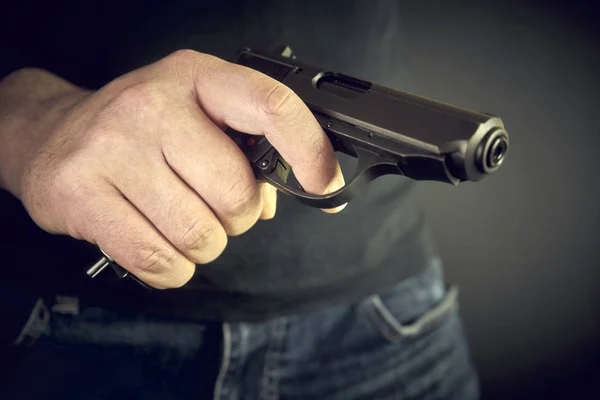man with hand gun pistol rubber attack violence