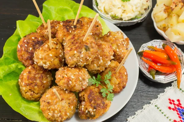 Meatballs on sticks decorated with vegetables — Stock Photo, Image