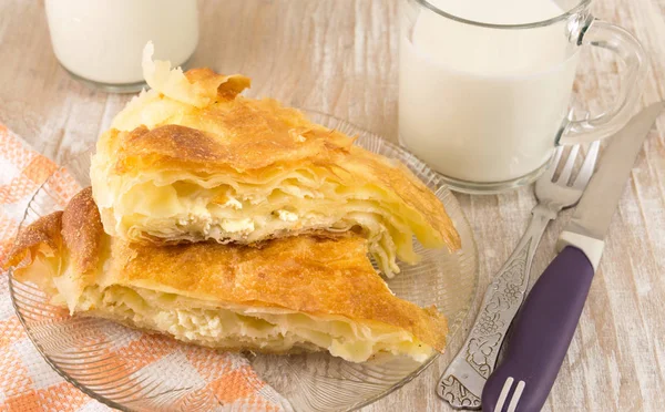 Cheese pie with a yogurt on a plate — Stock Photo, Image