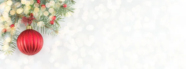 Christmas ball on shiny silver background — Stock Photo, Image