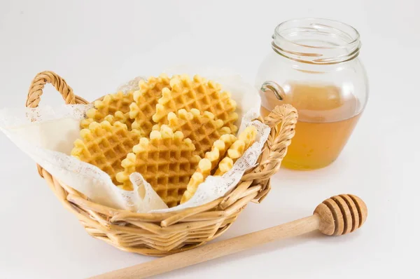Waffle cookies in a wicker basket — Stock Photo, Image