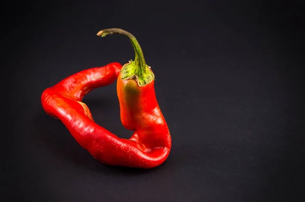 Red pepper on dark backgeround — Stock Photo, Image