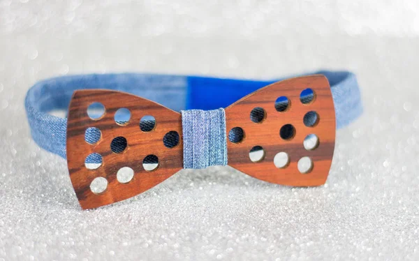 Wooden bow tie on silver background — Stock Photo, Image