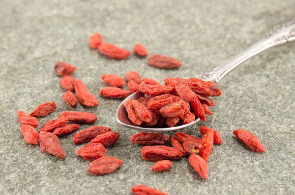 Goji berries in spoons — Stock Photo, Image
