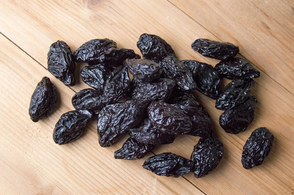 Bunch of dried plums on a table — Stock Photo, Image