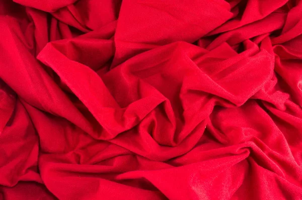 Vermelho enrugado tecido fundo — Fotografia de Stock