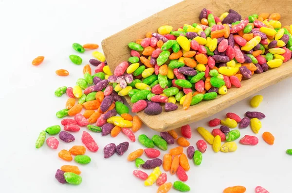 Mistura de bombons coloridos em colher de madeira — Fotografia de Stock