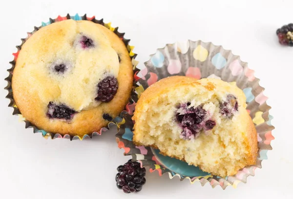 Blackberry muffins in paper cups — Stock Photo, Image