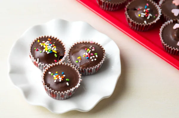Chocolate with colorful sprinkles — Stock Photo, Image