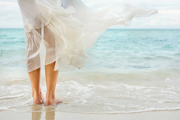 White dress waving on seaside wind — Stock Photo, Image