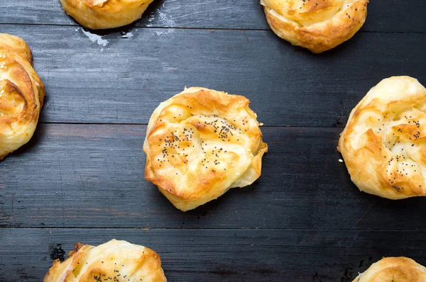 Homemade cheese pie rolls covered with sesame — Stock Photo, Image