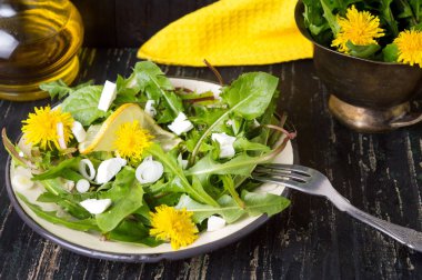 Dandelion salad with onions and cheese clipart