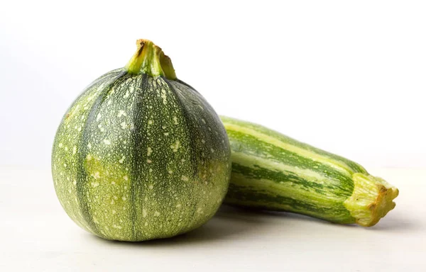 Zucchini, green summer squash on white — Stock Photo, Image