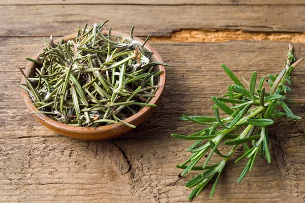 Rosemary plant in a wooden bowl — Stock Photo, Image