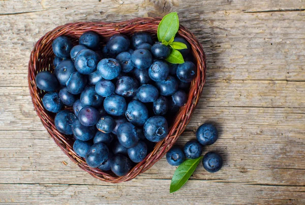 Blueberries in a heart shaped bowl — Stock Photo, Image