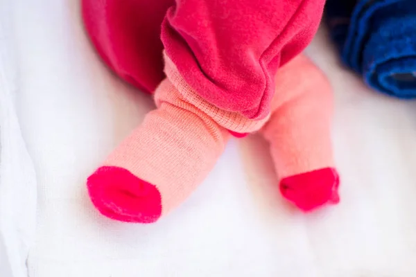 Baby girl feet wearing cute socks — Stock Photo, Image