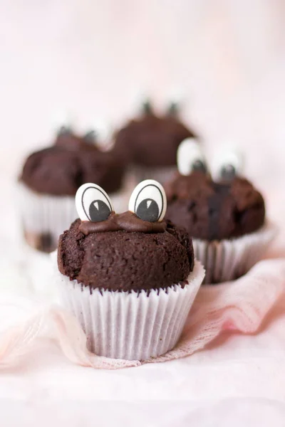 Chocolate muffins with edible eyes — Stock Photo, Image