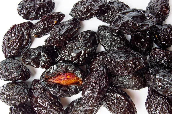 Dried plum fruits on white background — Stock Photo, Image