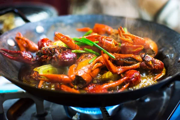 Hot and spicy crayfish pot served on the table — Stock Photo, Image