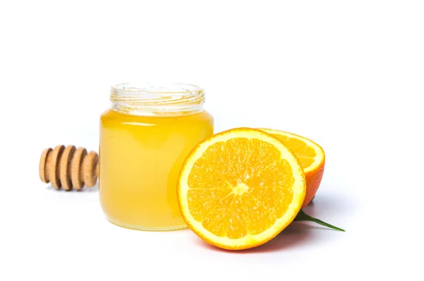 Βάζο με μέλι και πορτοκάλι απομονωθεί σε λευκό φόντο — Φωτογραφία Αρχείου