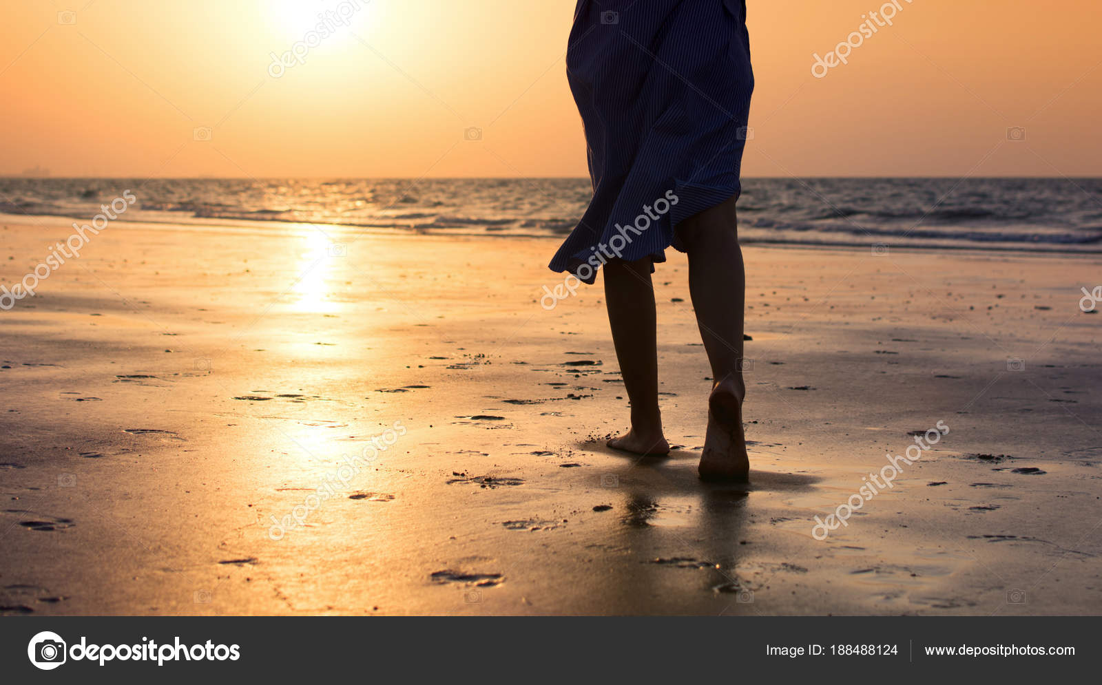 Girl Walking On The Beach At Sunset Stock Photo C Creativefamily