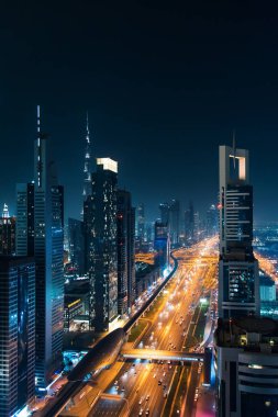 Downtown Dubai modern urban cityscape at night clipart