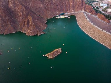 Aerial view of Hatta dam lake in Dubai emirate of UAE clipart