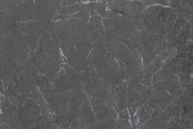 Grigio Karniko - gri ve beyaz veining bir ağ ile zarif gri, koyu gri veya neredeyse siyah mermer.