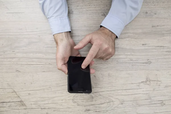 Businessman with phone and tablet