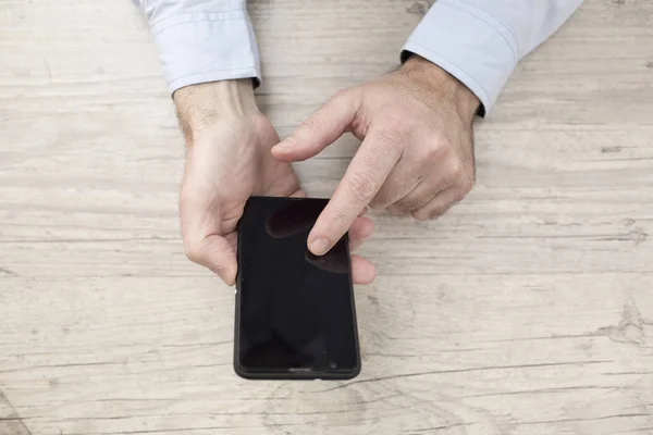 Businessman with phone and tablet