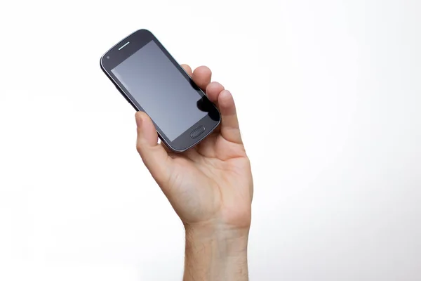 Smartphone uzanmış bir el — Stok fotoğraf
