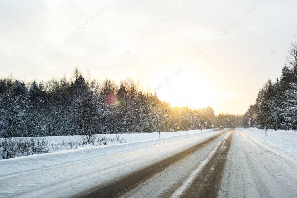 close-up car on a winter road in a blizzard