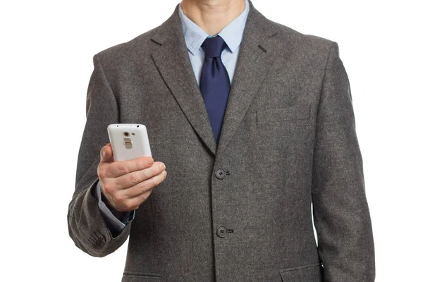 Επιχειρηματίας με ένα γκρι κοστούμι με ένα τηλέφωνο στο χέρι και με ένα p — Φωτογραφία Αρχείου
