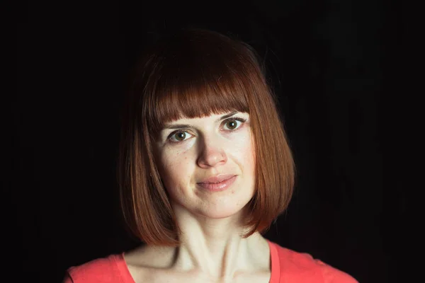 Portrait. Girl on a black background — Stock Photo, Image