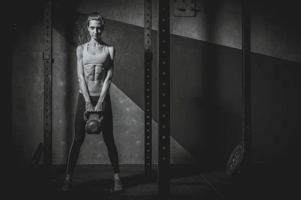 Gym. She squats with a barbell — Stock Photo, Image