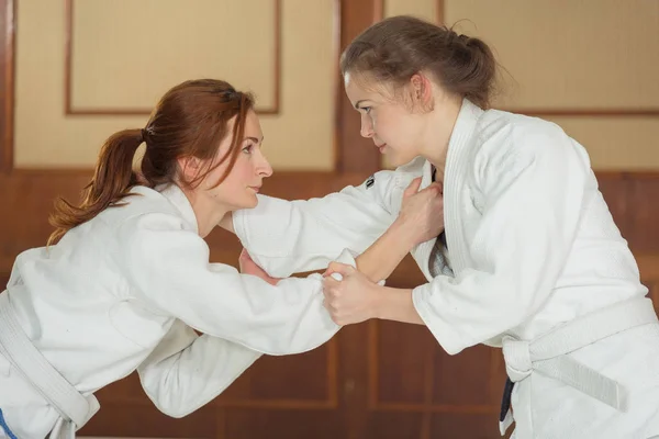 Women's section of Jiu Jitsu. Girls work out the reception.