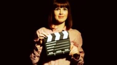 Bir film filme. O bir film clapper tokat