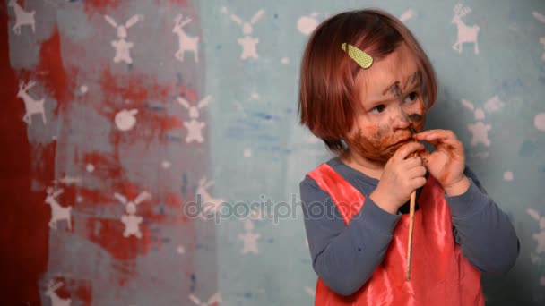 Portrait of a child stained with paints — Stock Video