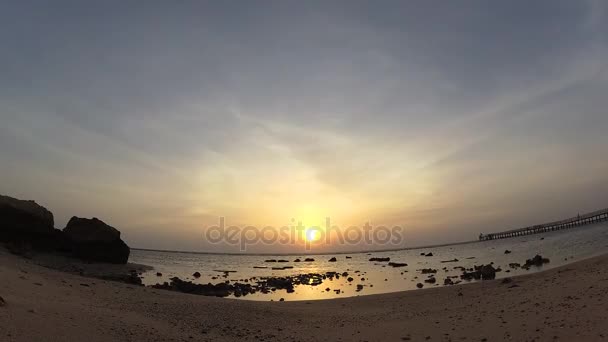 Timelapse. The sun comes out from the sea — Stock Video